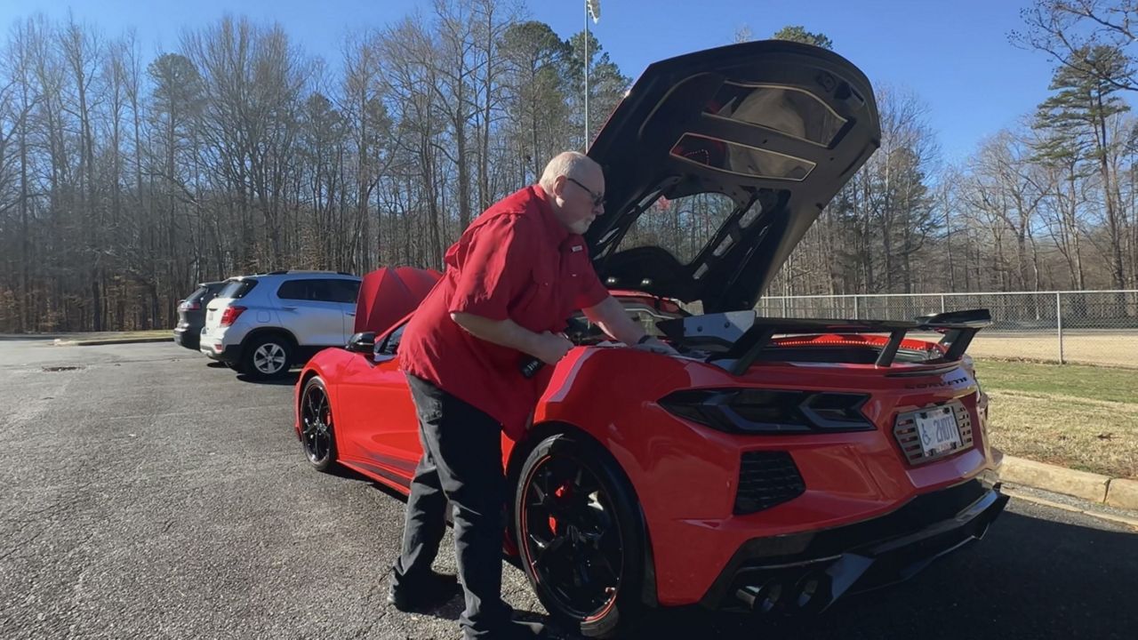 Keith Overcash, polishing his Corvette.